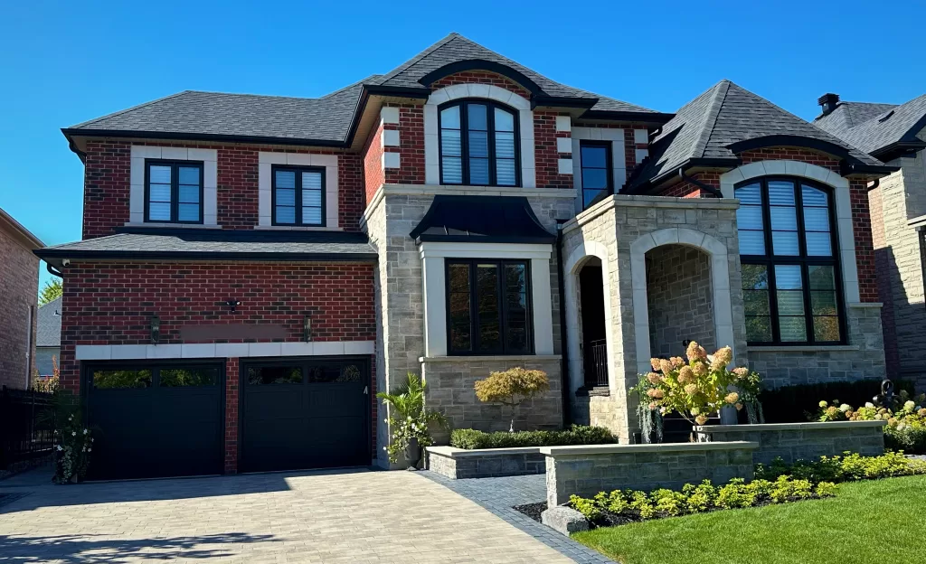 front of large home with painted windows and doors